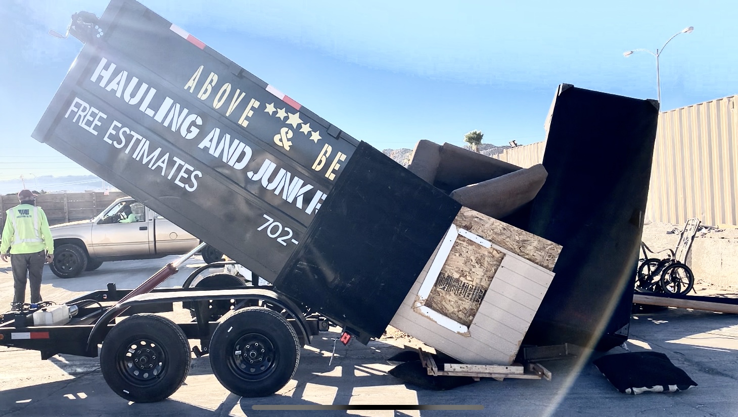 Above and Beyond Hauling dump trailer loaded with furniture and junk removal Las Vegas