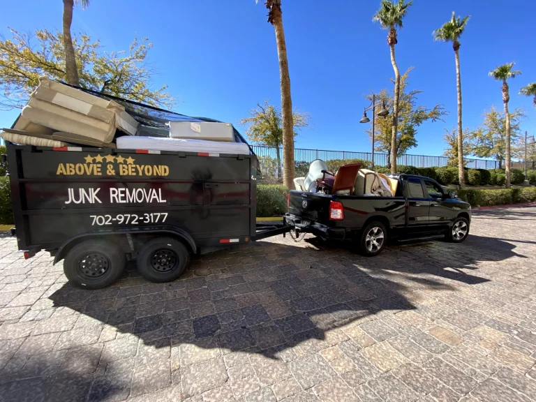 Above & Beyond Hauling pickup truck and branded dump trailer