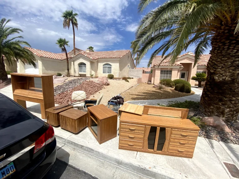 Pile of furniture and junk in a Las Vegas driveway ready for pickup